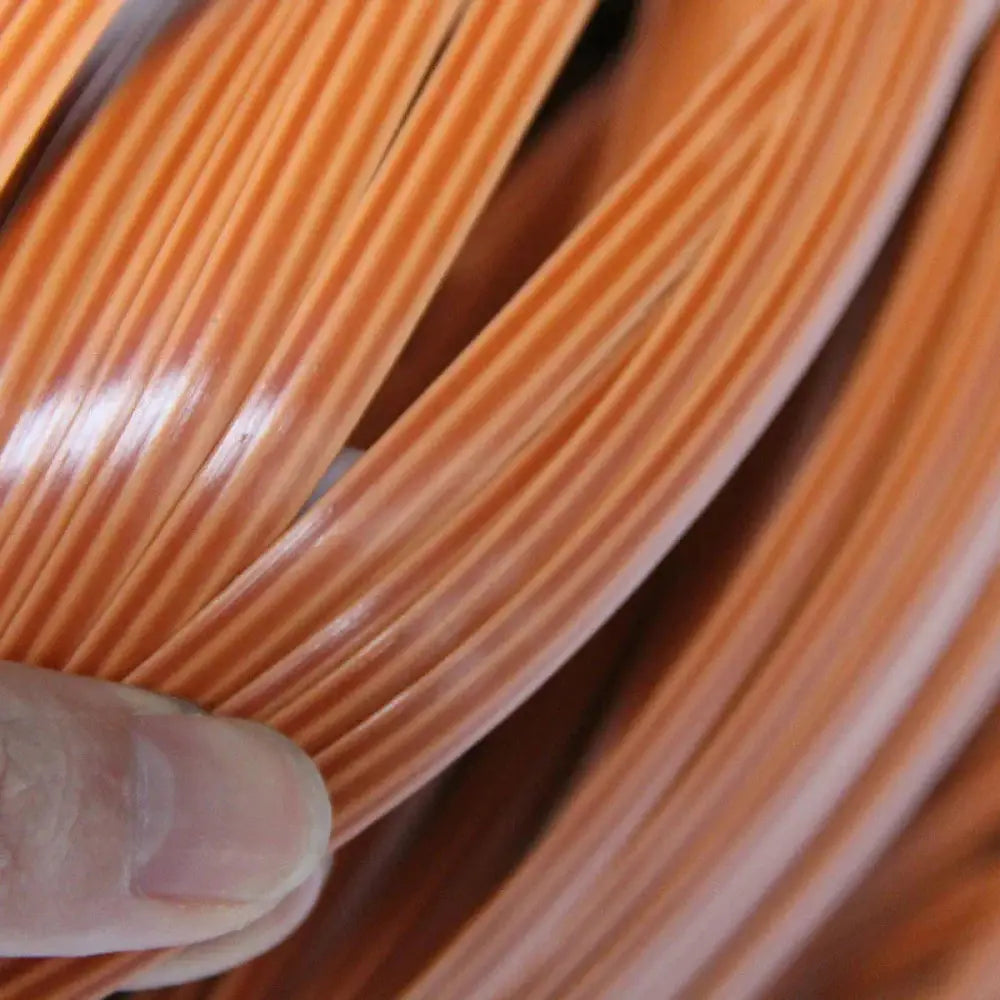 Orange striped plastic cable featured as part of premium rattan wicker repair and decoration strips
