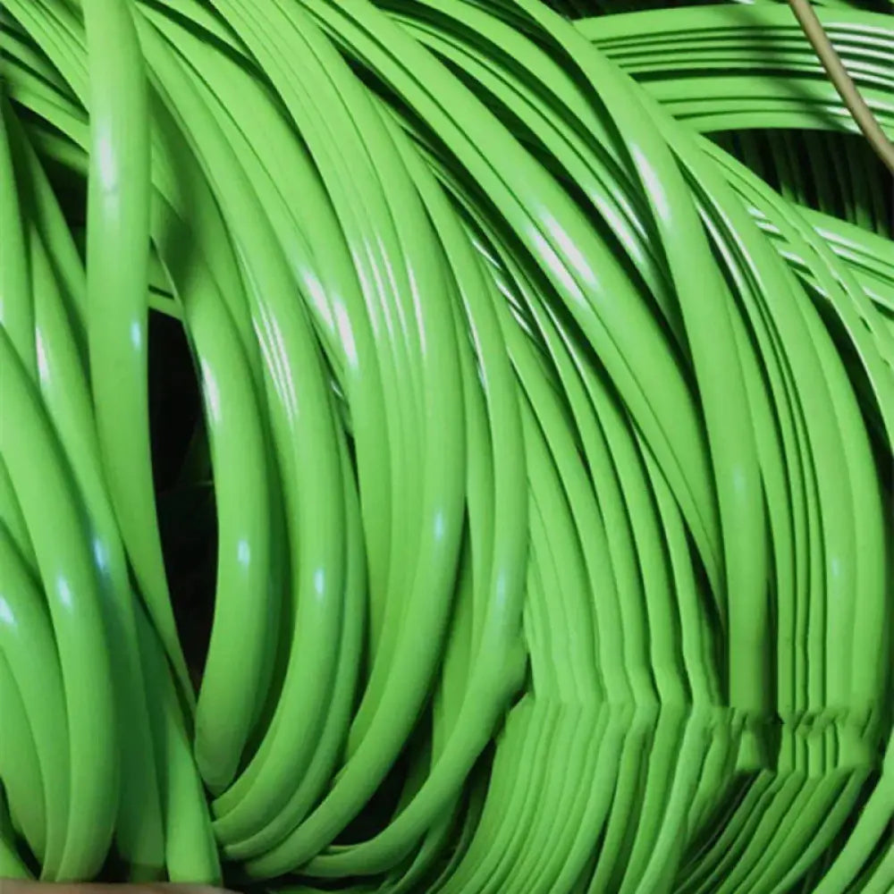 Coiled neon green rubber tubing used as premium rattan wicker repair and decoration strips