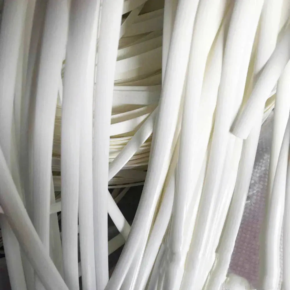 A bundle of white cylindrical plastic straws featured in premium rattan wicker repair and decoration strips