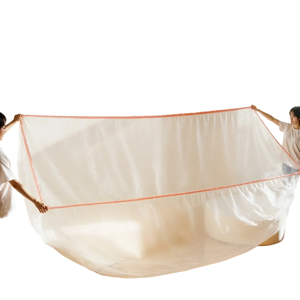 Transparent plastic furniture dust cover with peach-colored reinforced edges for protective film use