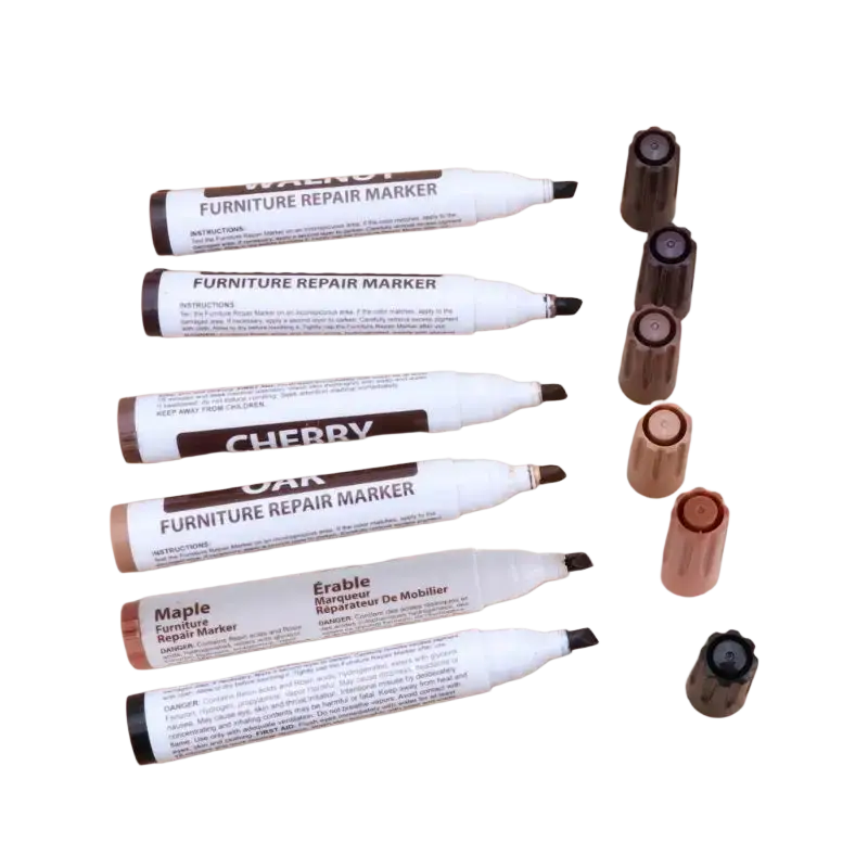 Set of six white and brown furniture repair markers with wax sticks labeled for cherry oak maple and erable wood tones