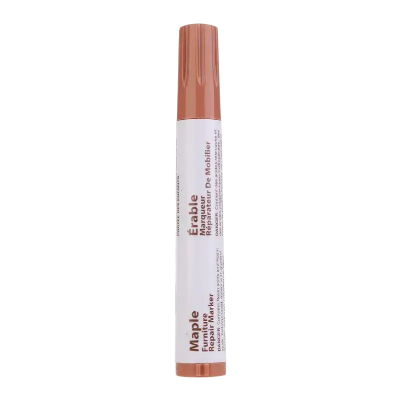A sleek cylindrical repair marker with a matte copper cap for furniture repair in a wax sticks set