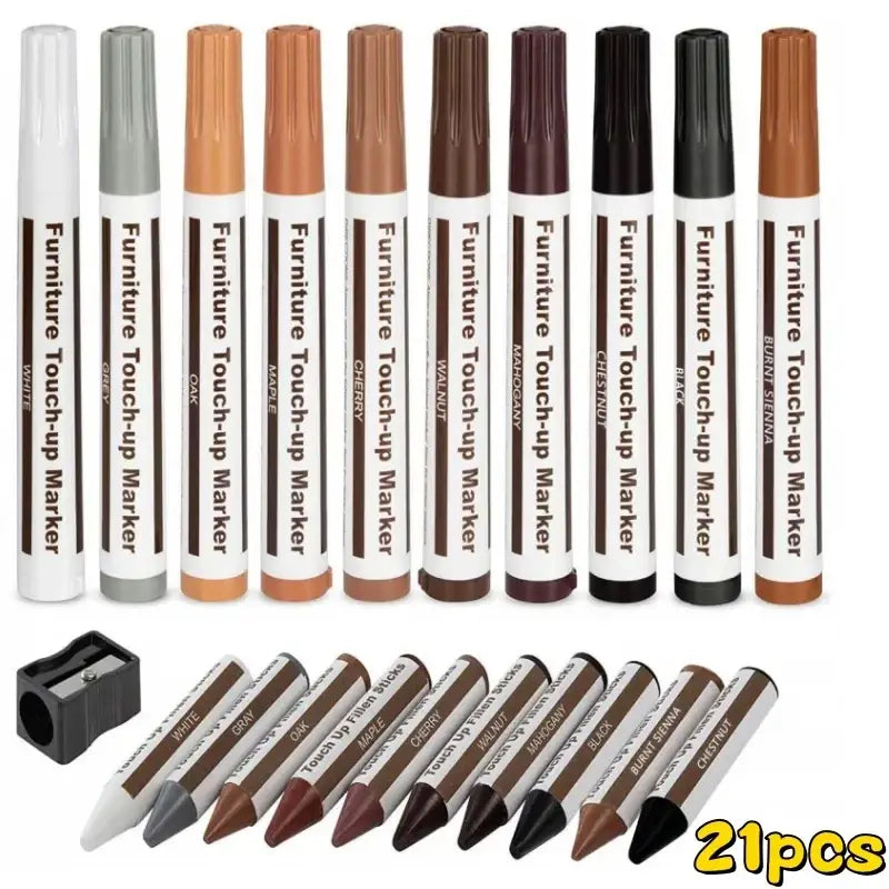 Set of 21 furniture repair pens and wax sticks in assorted wood tones with pencil-style refills and black sharpener