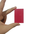 A solid vibrant pink rectangular eraser held in hand for use with the game card storage box v2 accessory case