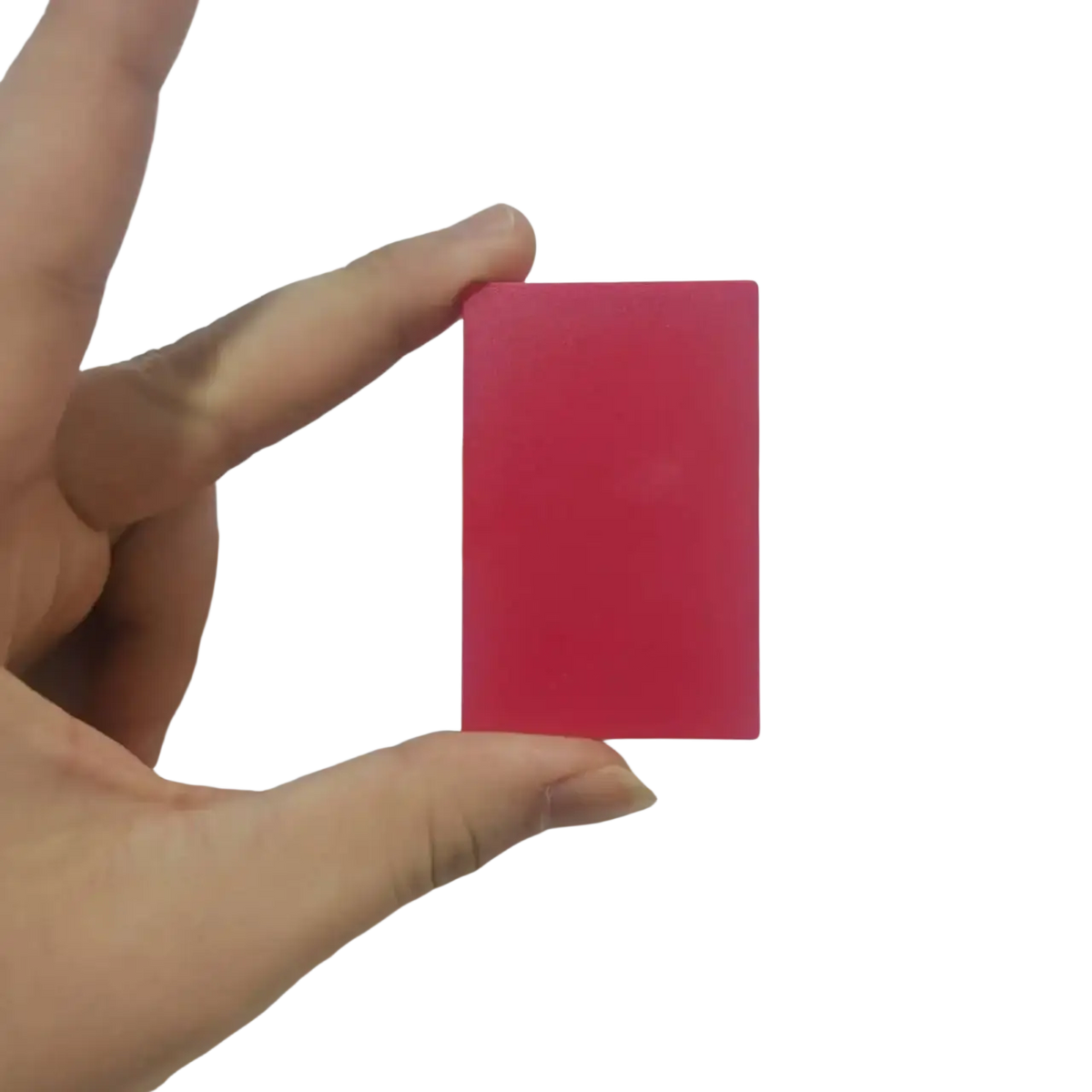 A solid vibrant pink rectangular eraser held in hand for use with the game card storage box v2 accessory case