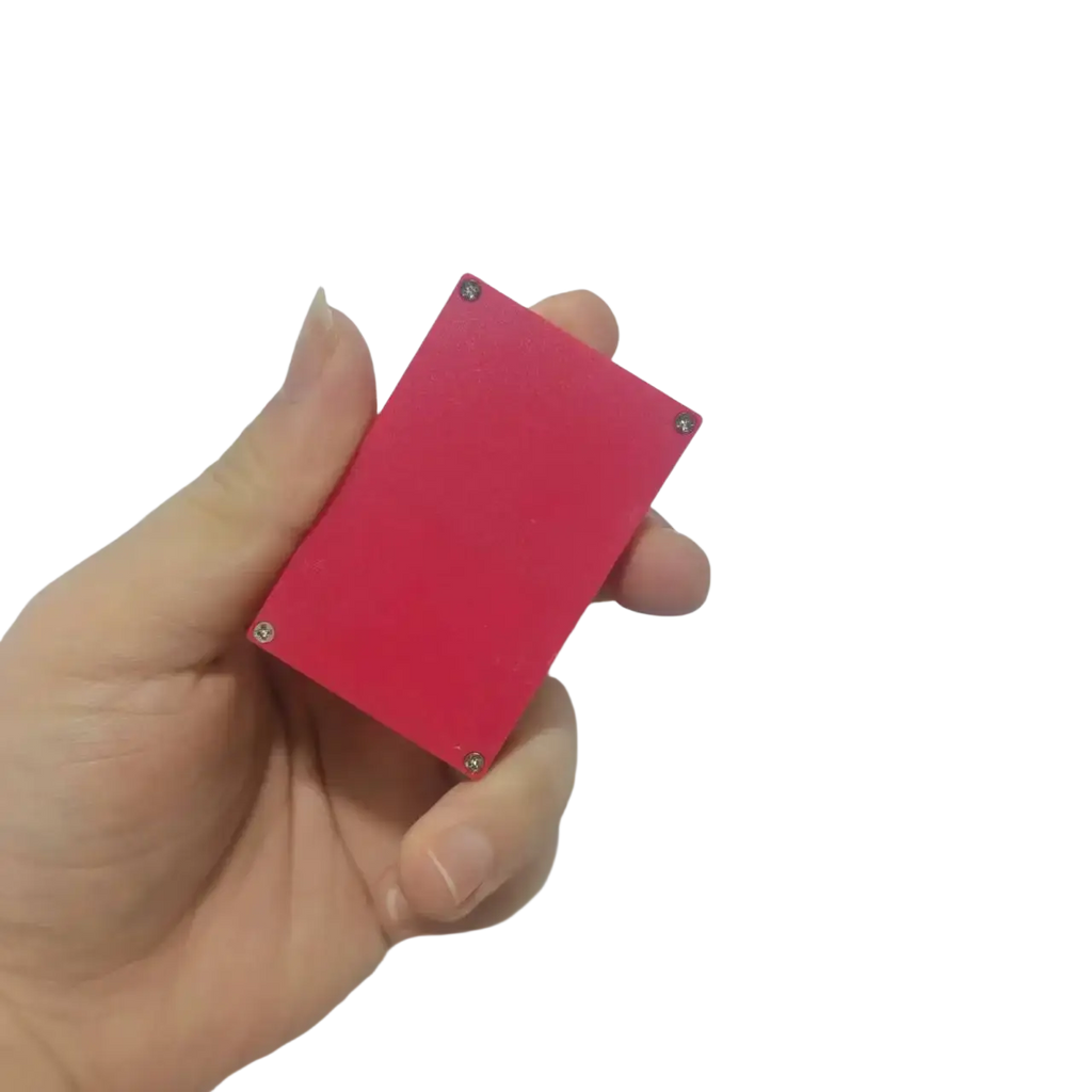 A vibrant red rectangular game card storage box with four silver screws for secure accessory case protection