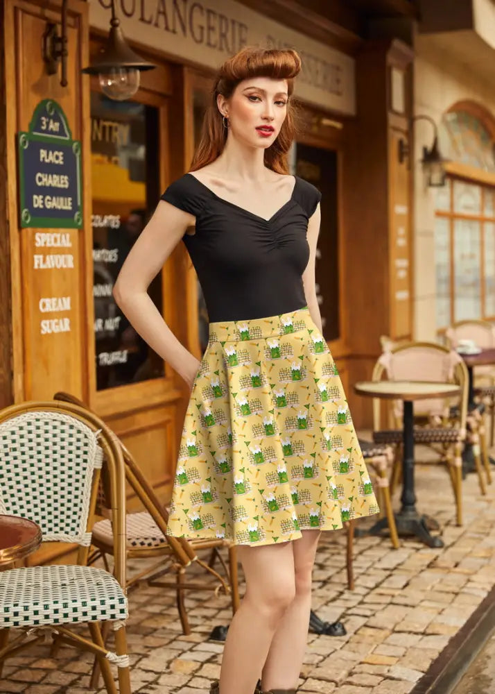 Garden bunny yellow cotton skater skirt featuring green and white geometric pattern on yellow fabric
