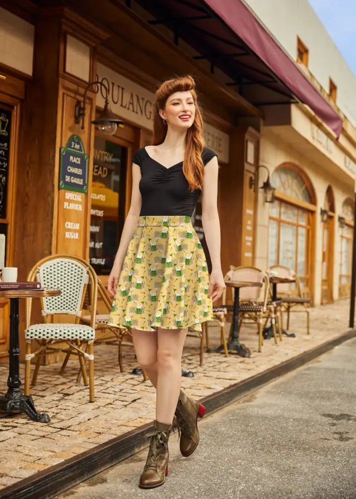 Yellow cotton Garden Bunny skater skirt with a playful green and white beer mug pattern and flared a-line silhouette