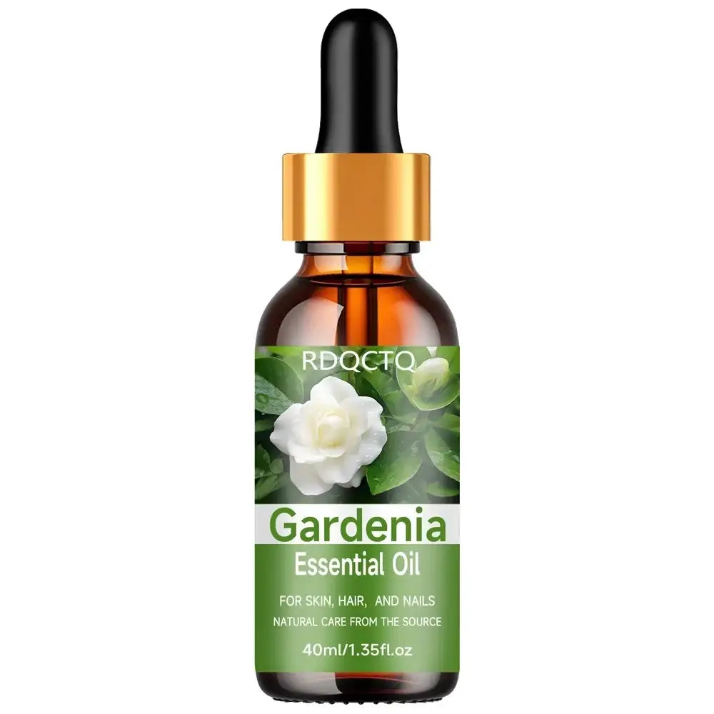 A 40ml amber glass bottle of gardenia essential oil with a gold dropper cap and green label featuring white flowers