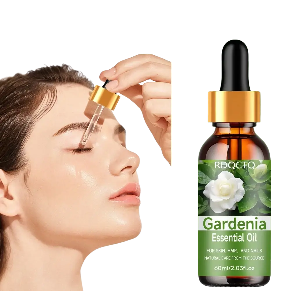 A dark amber glass bottle with gold dropper cap labeled gardenia essential oil by rdqcto natural gardenia essential serum