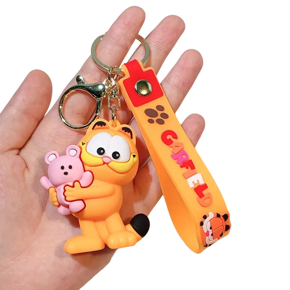 Orange rubber Garfield keychain featuring a pink bear charm and Garfield lettering on an orange wrist strap