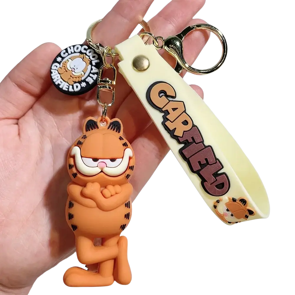Orange rubber Garfield keychain with black stripes and cream wrist strap featuring the Garfield logo in brown lettering