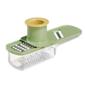 Green and yellow plastic vegetable slicer with clear tray for garlic grinding in stainless steel garlic grinder food chopper