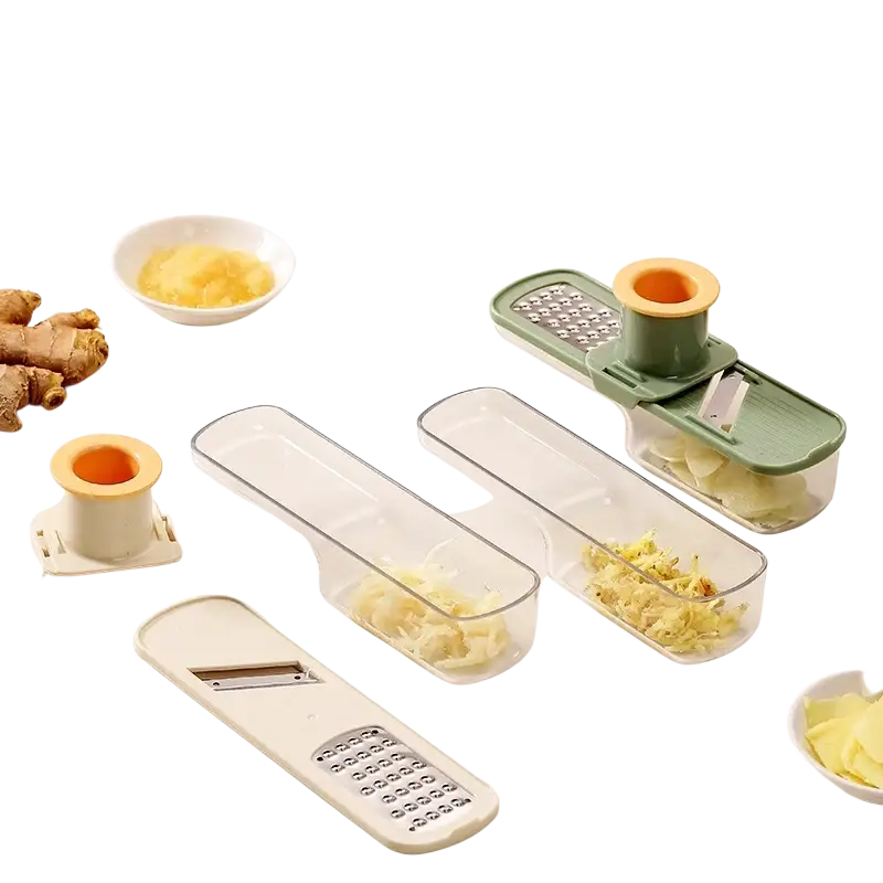 Multifunctional garlic grinder with stainless steel blades, green white plastic body, and clear collection trays for garlic grinding