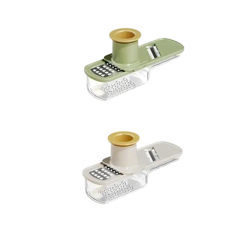 A sleek garlic grinder stainless steel food chopper with a translucent base and sage green top featuring adjustable blades