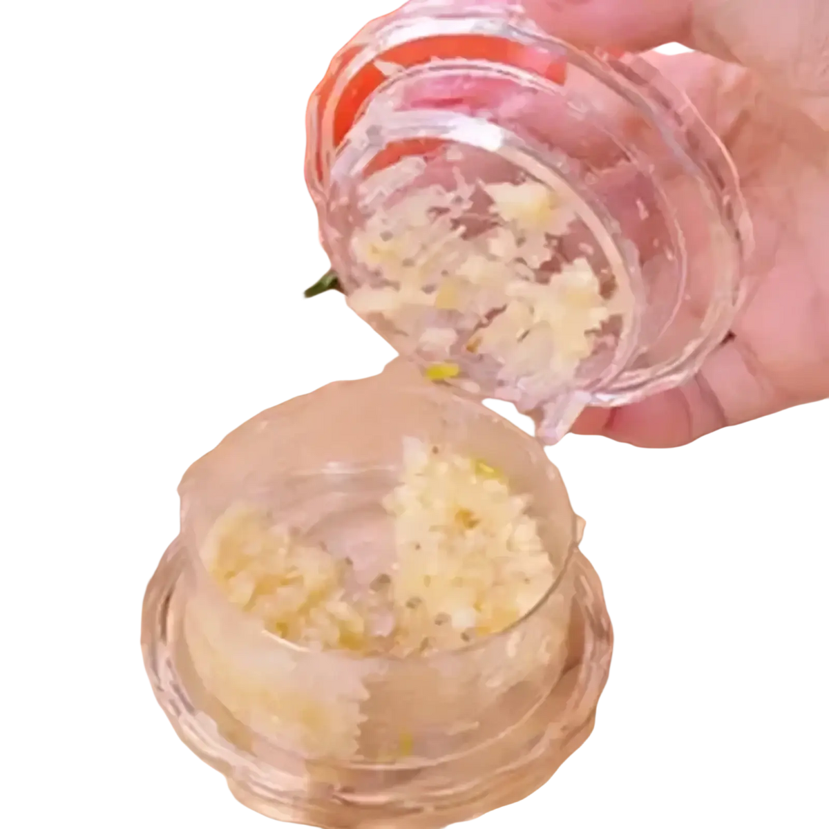 Clear plastic manual garlic press with textured ridged interior for finely mincing cloves multifunctional kitchen tool