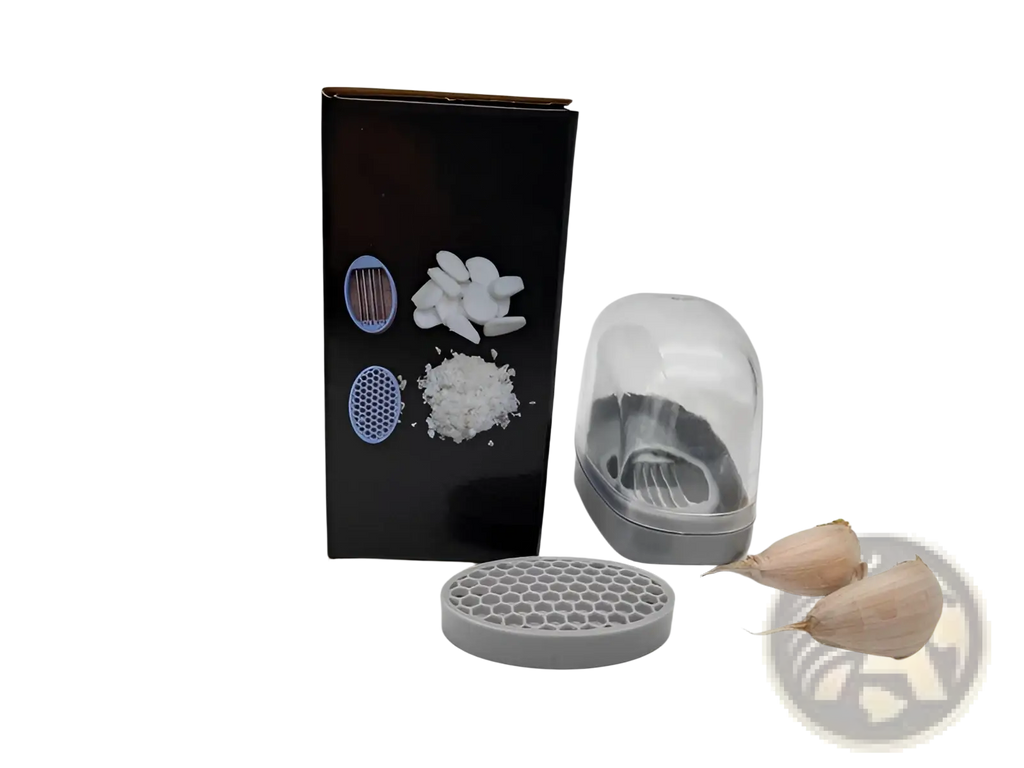 Gray plastic garlic press with stainless steel blades, clear dome lid, and interchangeable grinding plates in gray case