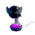 Gastly 3d printed luminous humidifier featuring a black and white koopa troopa figurine with glowing purple lights on a poké ball base