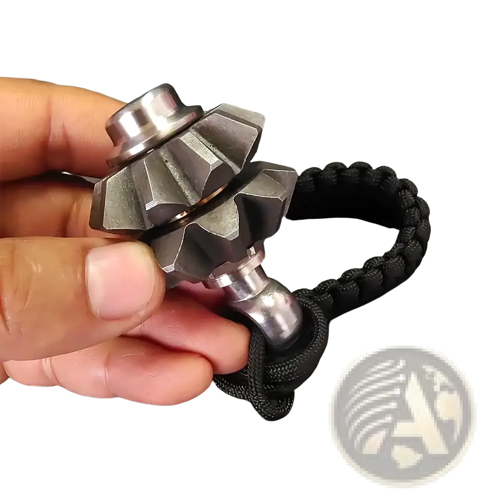 A sleek metallic gear fidget spinner keychain with a black paracord lanyard for emergency survival use