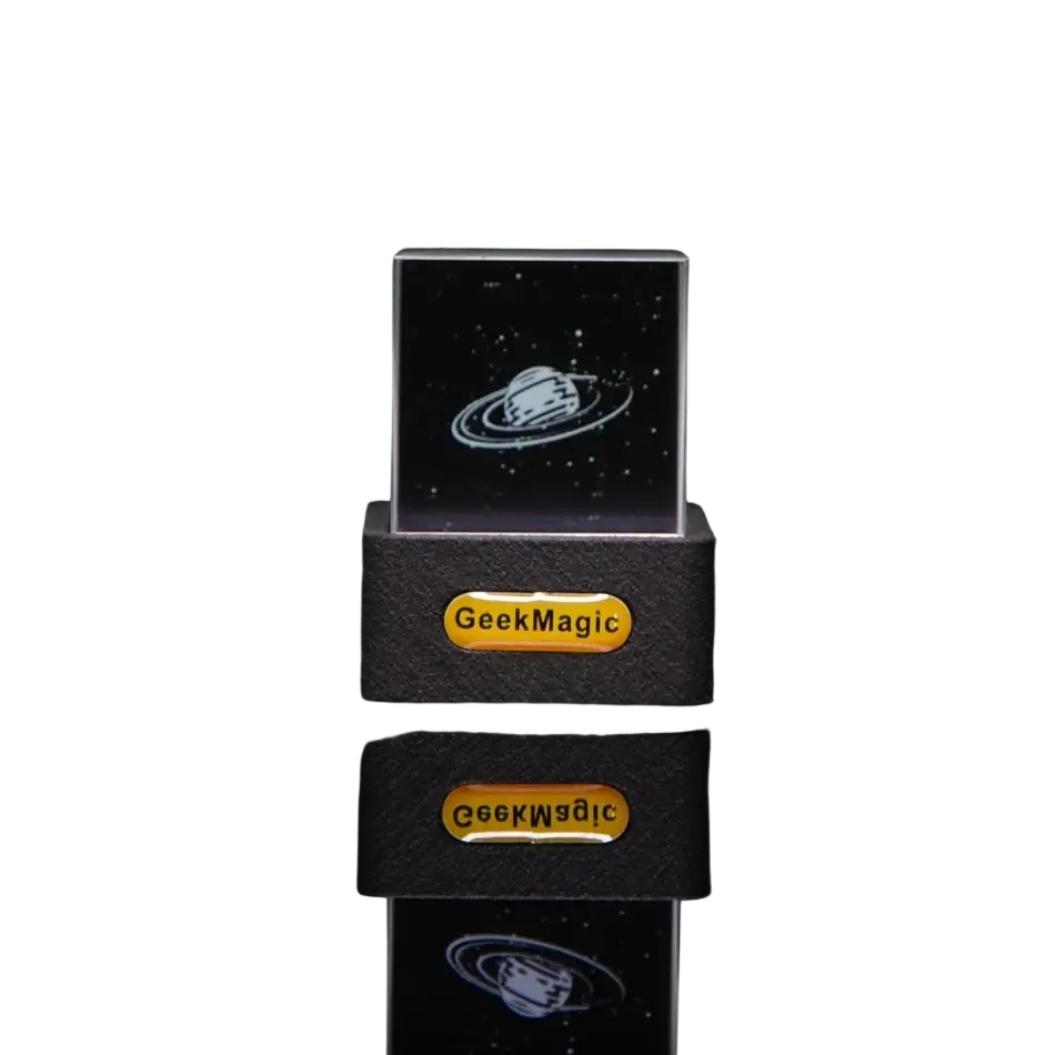 Geekmagic smart weather station crystal gif clock featuring a clear acrylic cube with white engraved saturn on black base