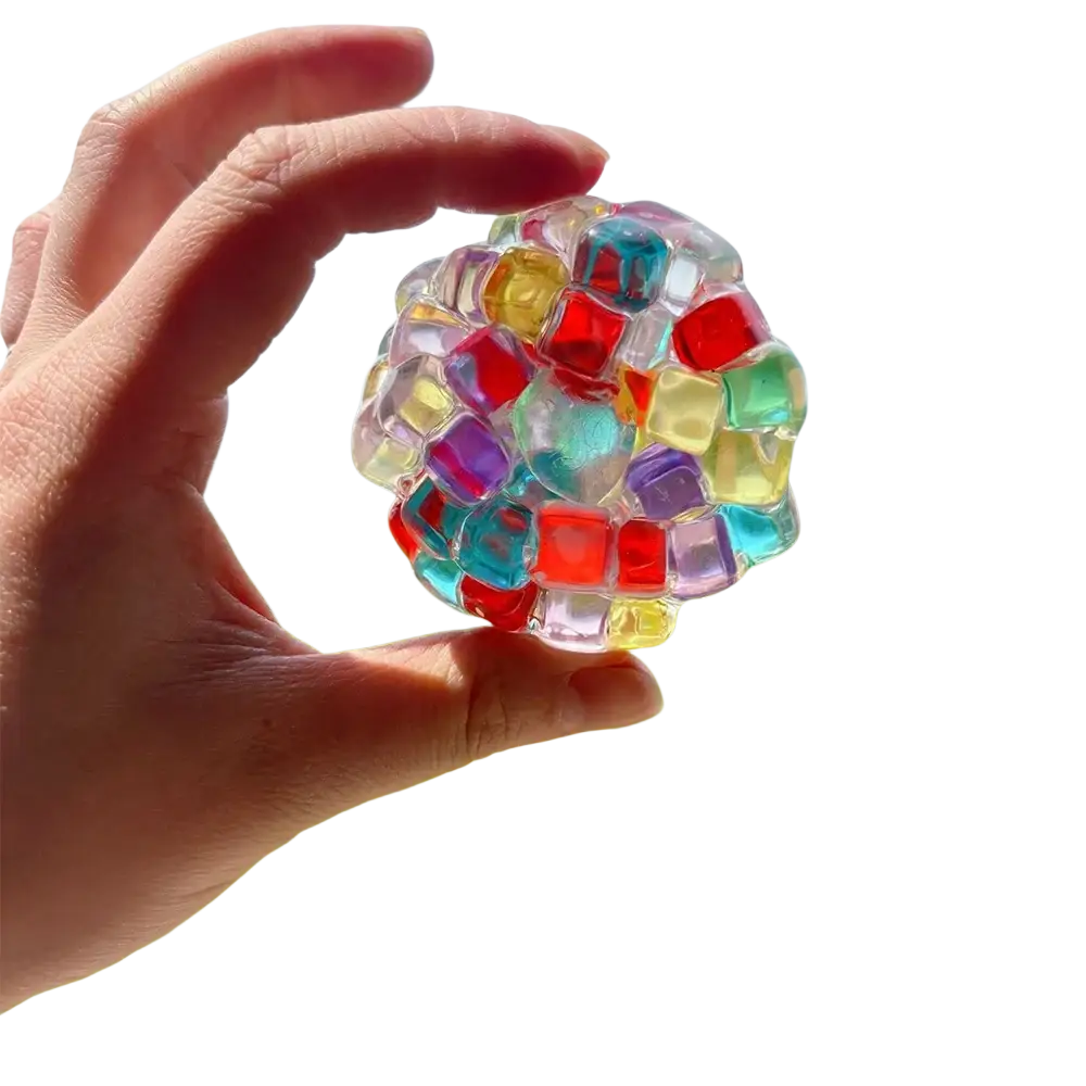 Colorful translucent gel ice bead stress relief squeeze toy composed of interlocking red blue yellow green and purple cubes