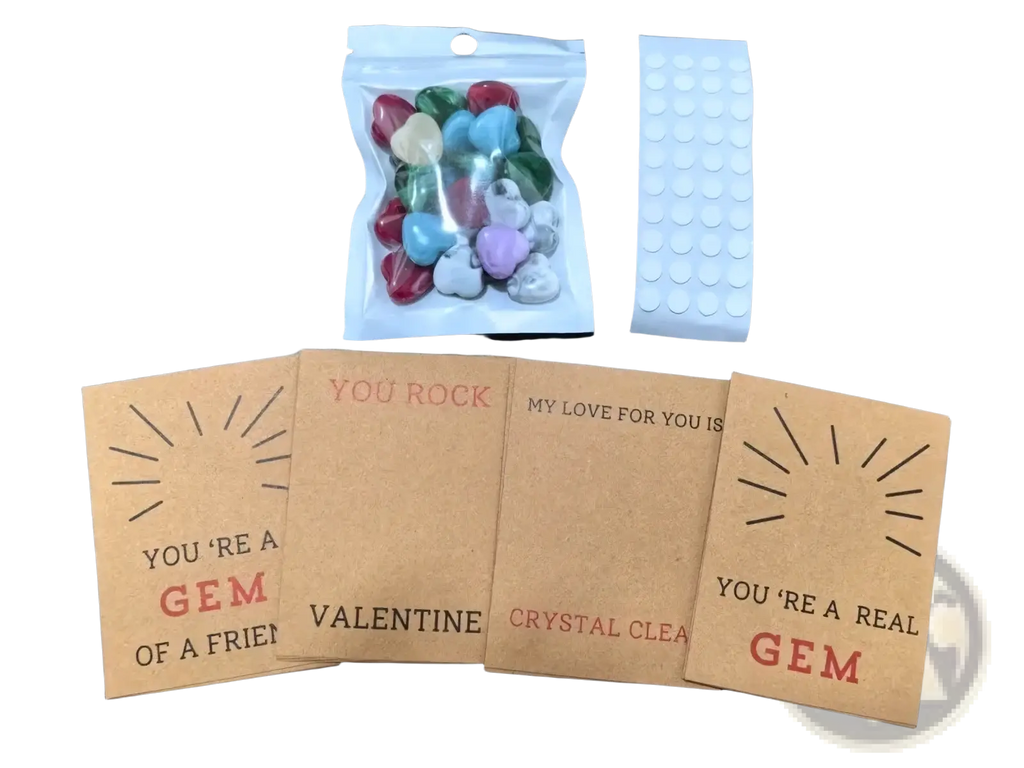 A clear plastic bag filled with colorful heart-shaped candy gems in red blue green and purple for gemstone heart valentine cards 24 pack