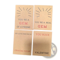 Four square kraft paper gemstone heart valentine cards with embossed sunburst designs and printed messages