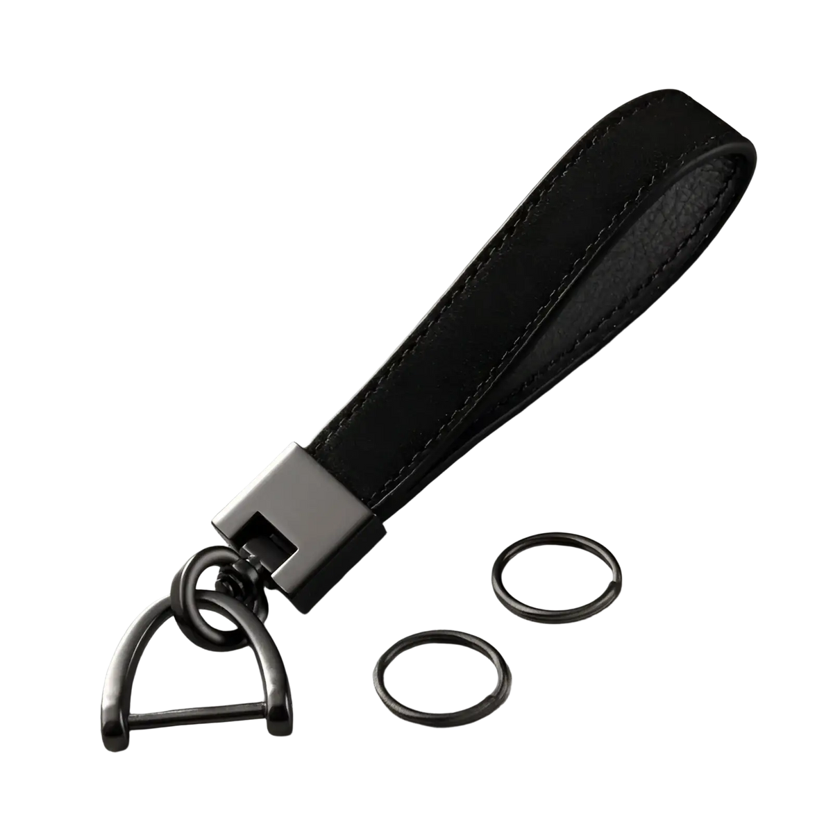 Genuine leather car keychain in black with matte black metal d-ring and two additional metal rings