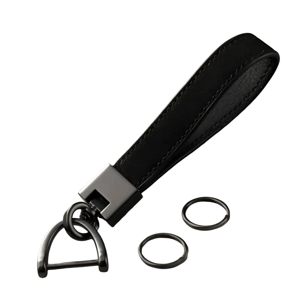 Genuine leather car keychain in black with matte black metal d-ring and rectangular connector plus two additional rings