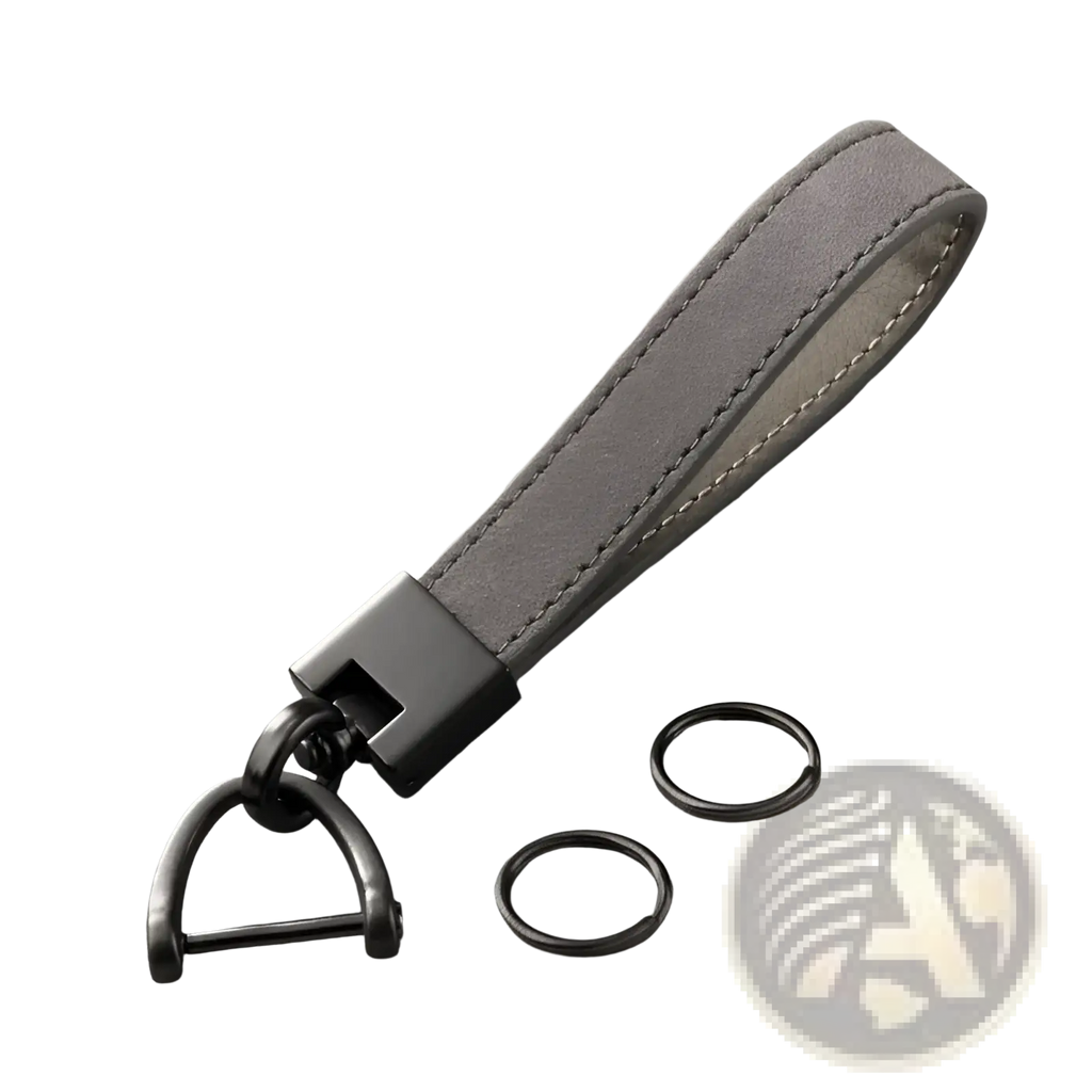 Genuine leather car keychain in gray suede with black metal hardware and d-ring attachment for keys