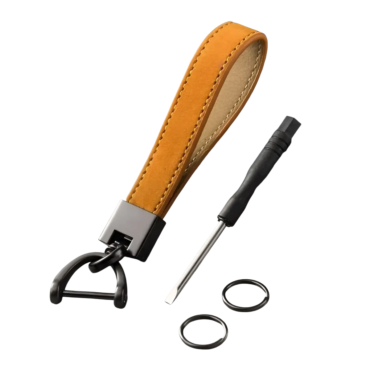 A tan genuine leather car keychain with black metal d-ring and clasp shown with two small rings and screwdriver