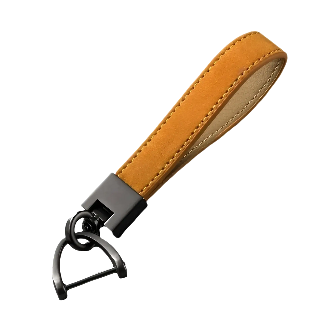 Tan suede genuine leather car keychain with black metal hardware and metal d-ring for secure key attachment