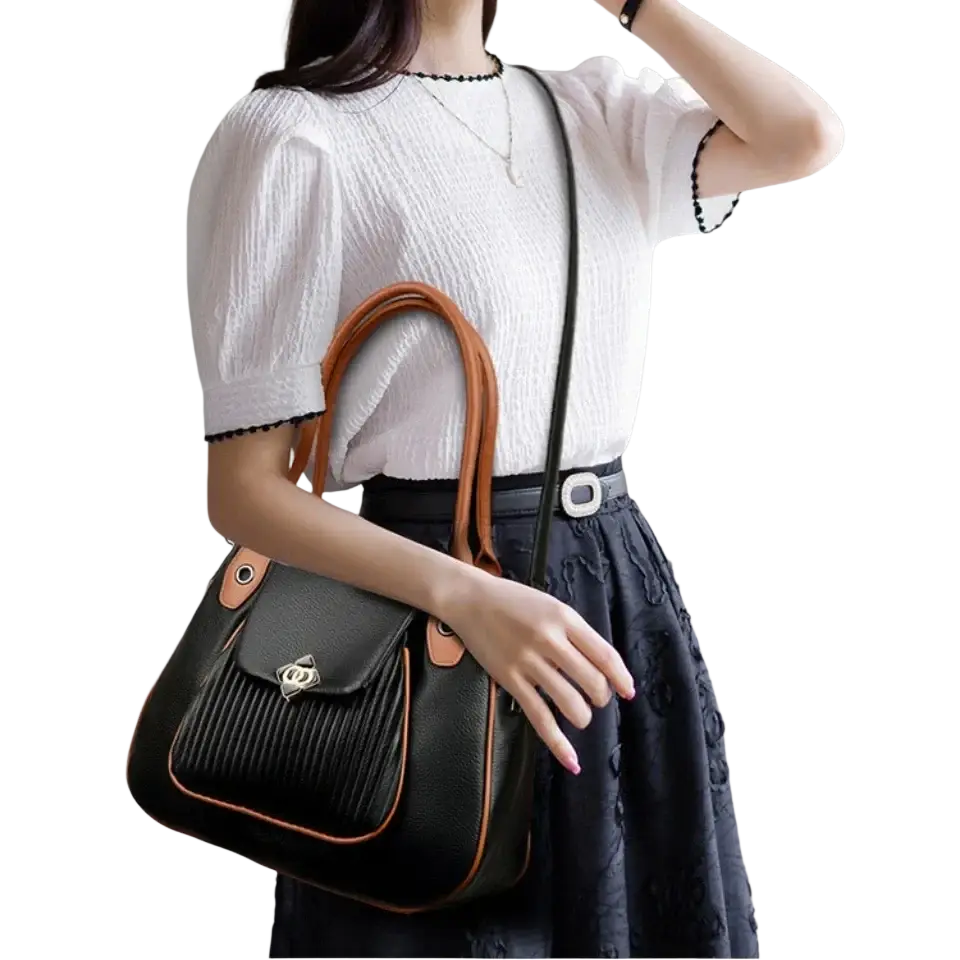 Black genuine leather casual tote shoulder bag with tan accents silver clasp and pocket interior details