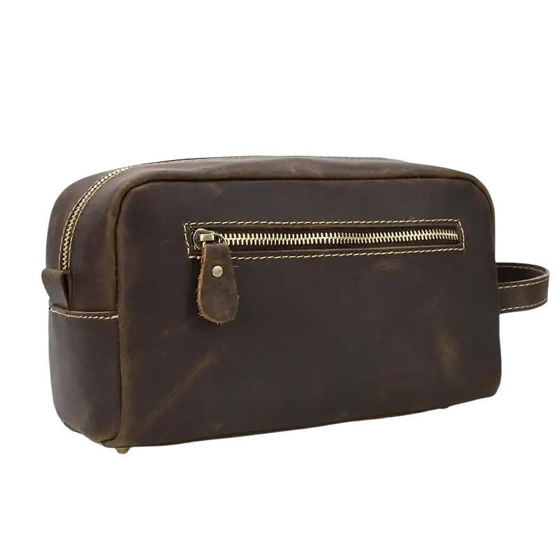 Brown genuine leather clutch bag size 26x15x11cm with gold-toned zipper and matching stitching for travel toiletry use