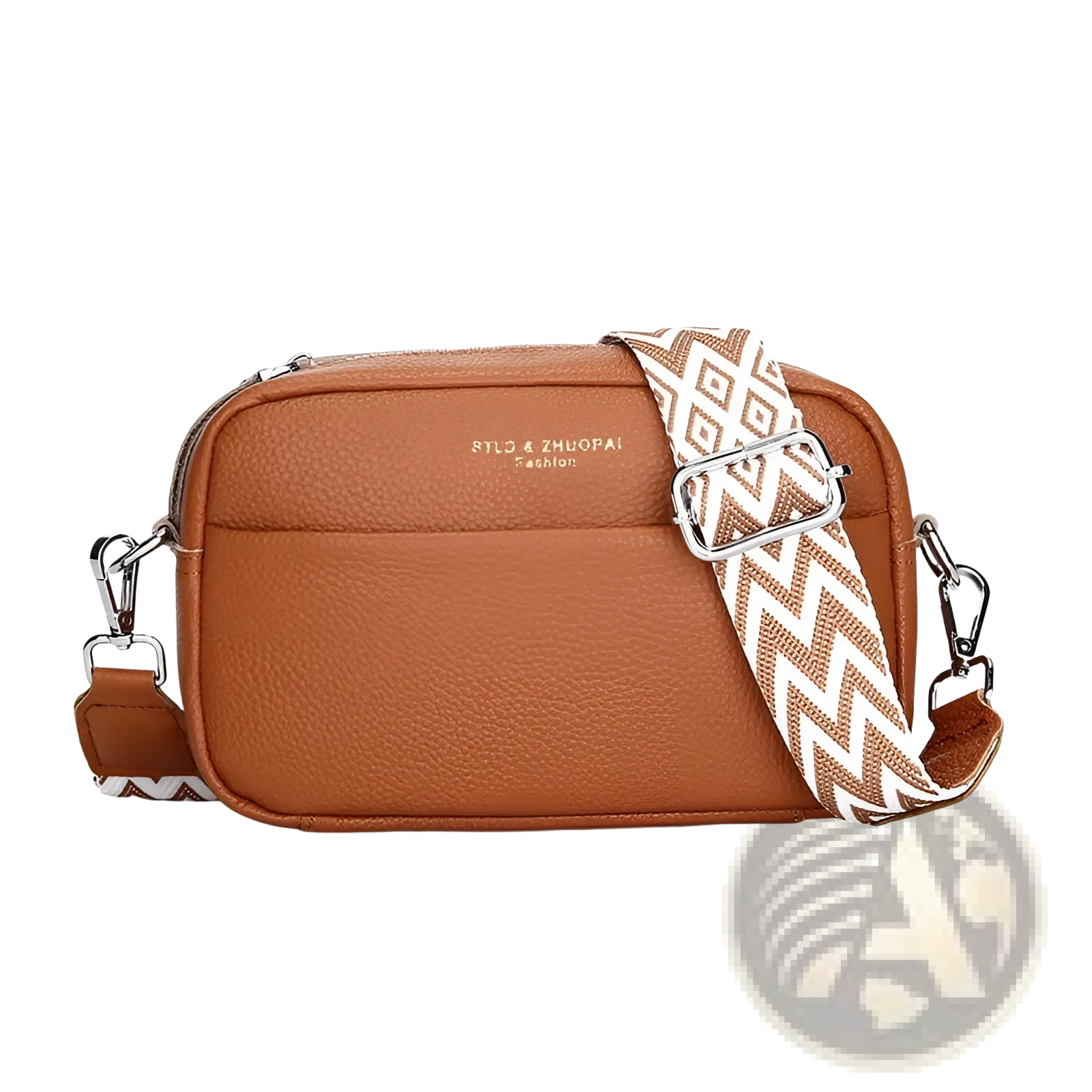 Genuine leather tan pebbled crossbody bag with white and brown zigzag geometric pattern strap