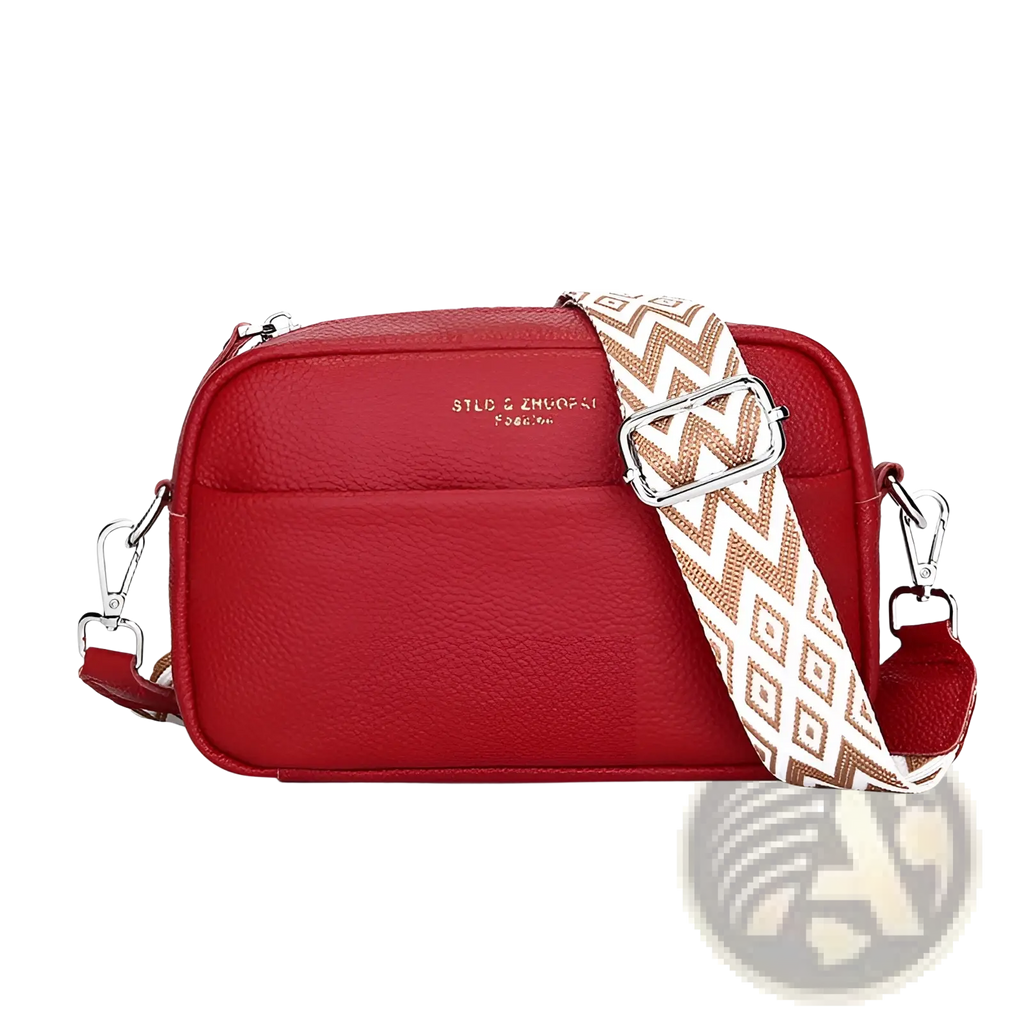 Red textured genuine leather crossbody bag with a beige and white geometric pattern strap