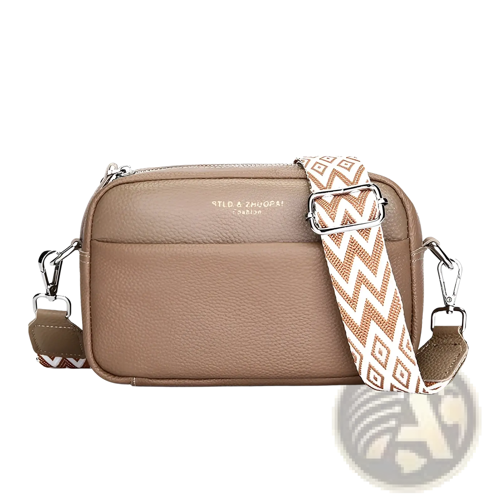 Genuine leather crossbody bag in tan with a zigzag and geometric patterned strap for versatile use