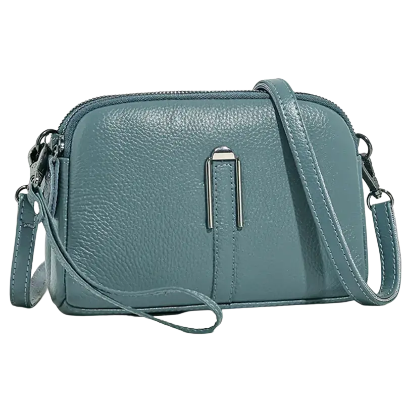 A sleek teal genuine leather crossbody bag for women with textured surface and silver-toned metal clasp