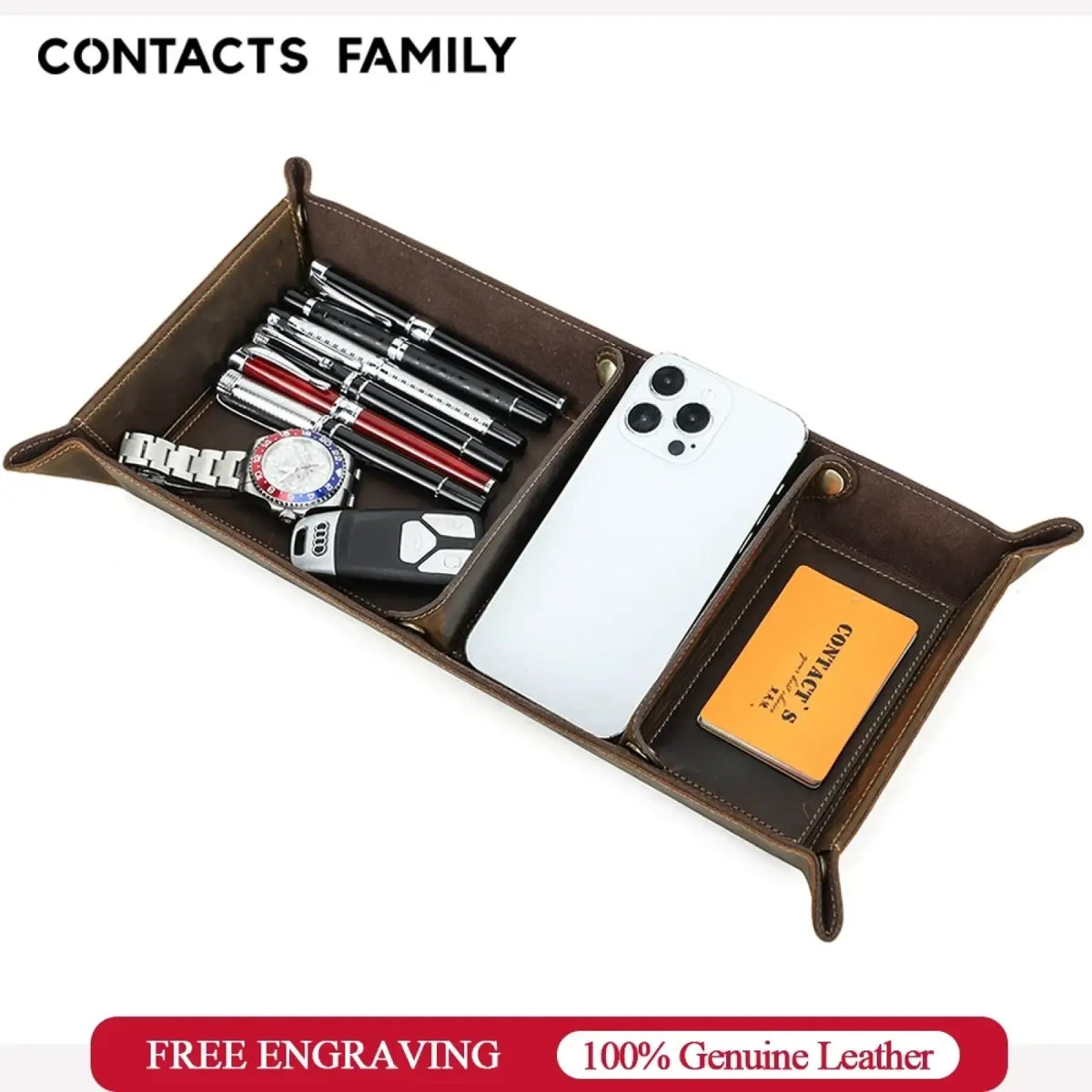 Genuine leather desktop organizer tray in brown with divided compartments holding pens, watch, phone, and cards