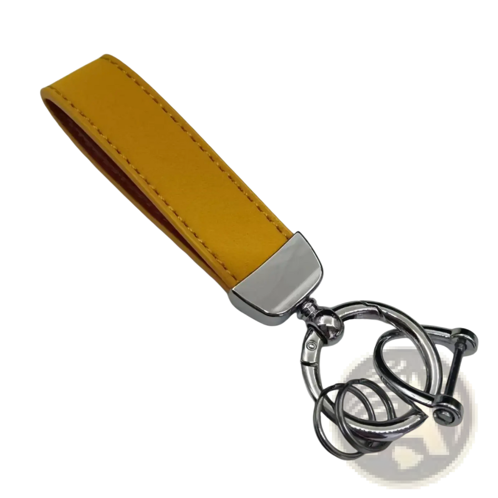 A mustard-yellow genuine leather keychain with a polished silver clasp and interlocking ring design for car keys