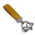 A mustard-yellow genuine leather keychain with a polished silver clasp and interlocking ring design for car keys