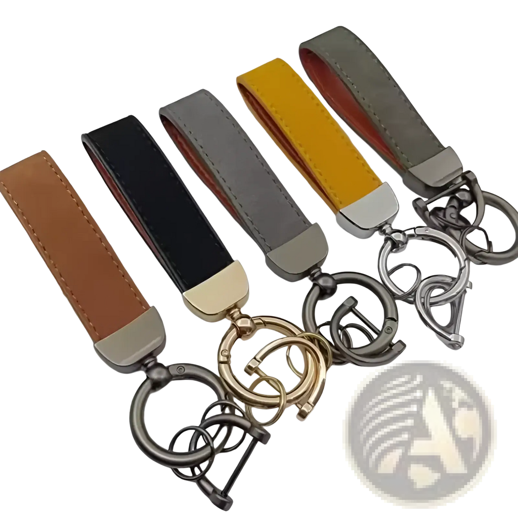 A set of five genuine leather keychains in tan black gray yellow and olive green with metallic hardware for car keys