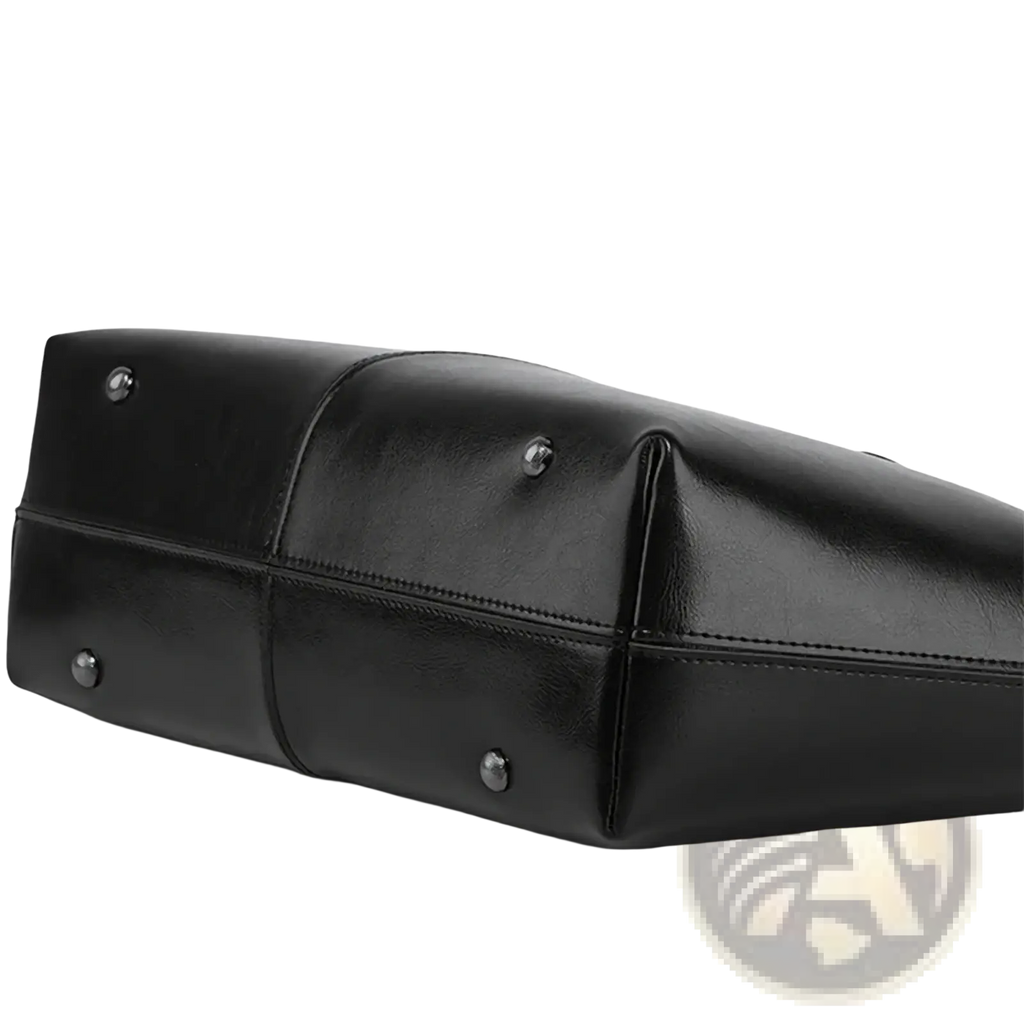 Black genuine leather laptop tote bag for women with silver-toned metal studs at the corners