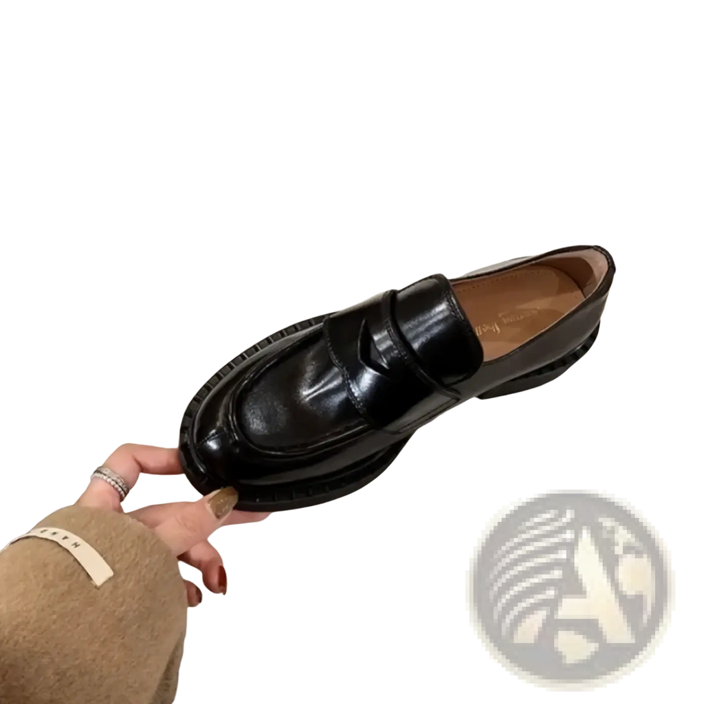 Genuine leather patent loafers in black with a thick textured sole and classic slip-on design