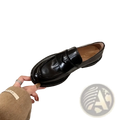Genuine leather patent loafers in black with a thick textured sole and classic slip-on design