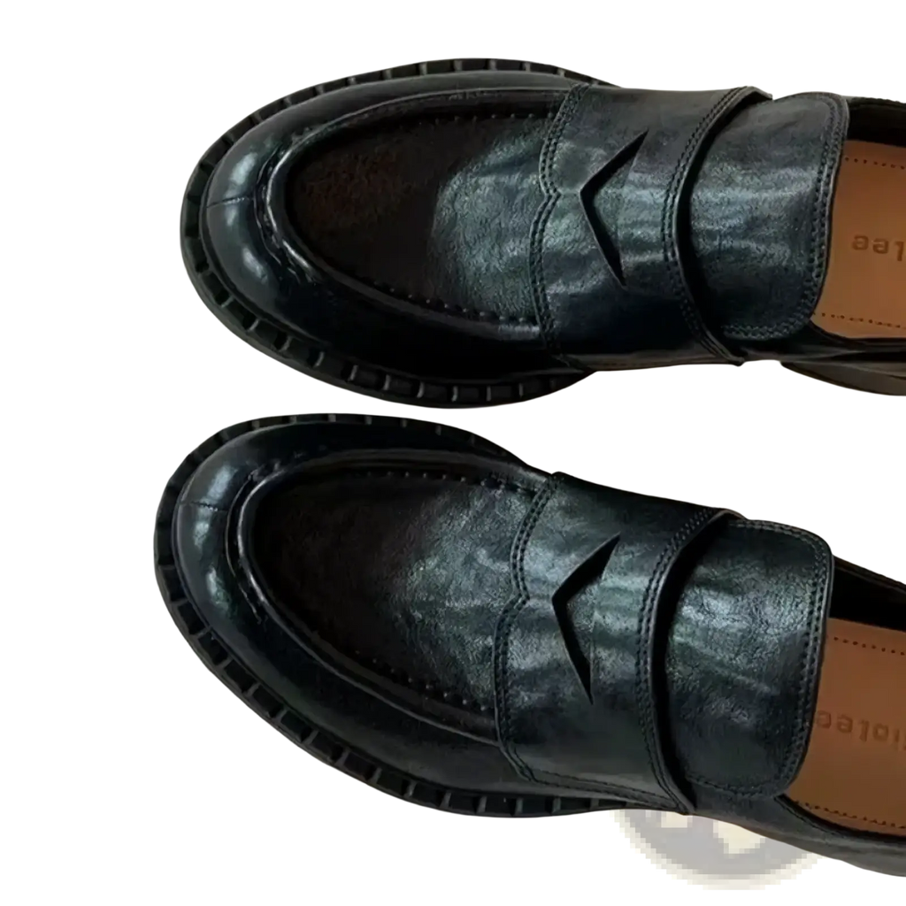 Genuine leather patent loafers in black with a glossy finish and distinctive v-shaped cutout on the vamp