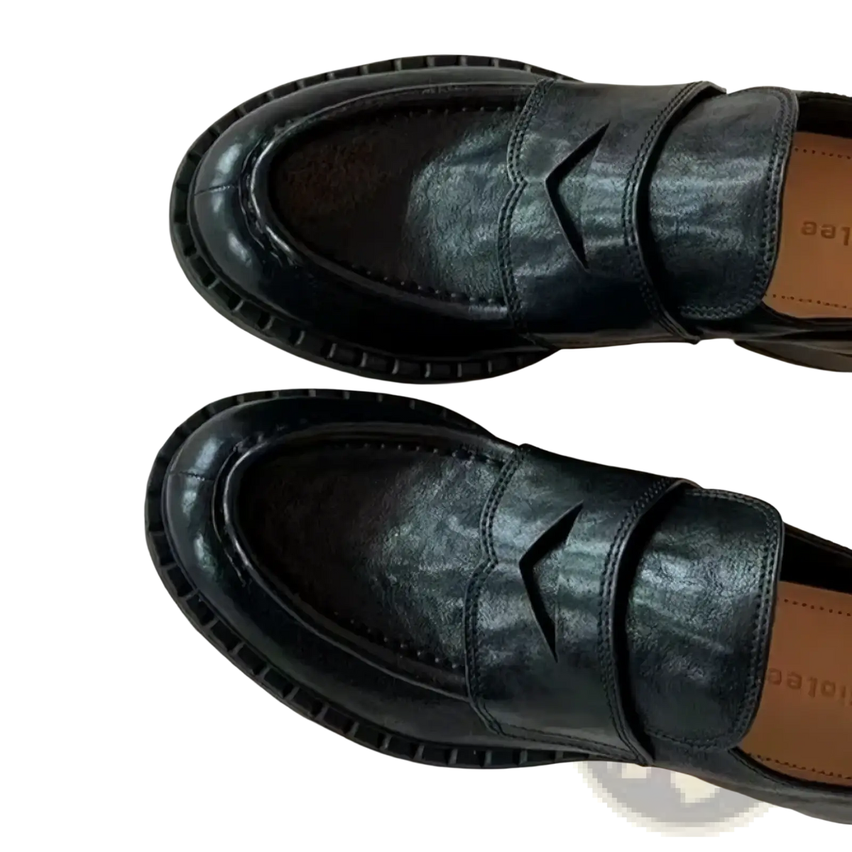 Genuine leather patent loafers in black with a glossy finish and distinctive v-shaped cutout on the vamp