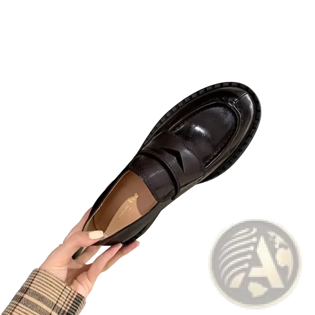 Genuine leather patent loafers in black with a glossy finish and a thick textured sole for durable wear