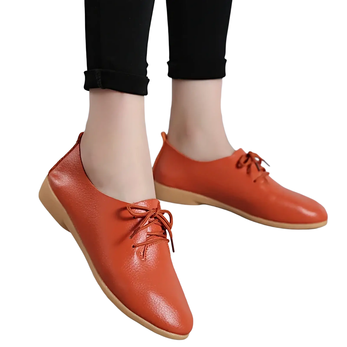 Orange genuine leather pointed toe women flats with lace-up design and light brown sole in a front view