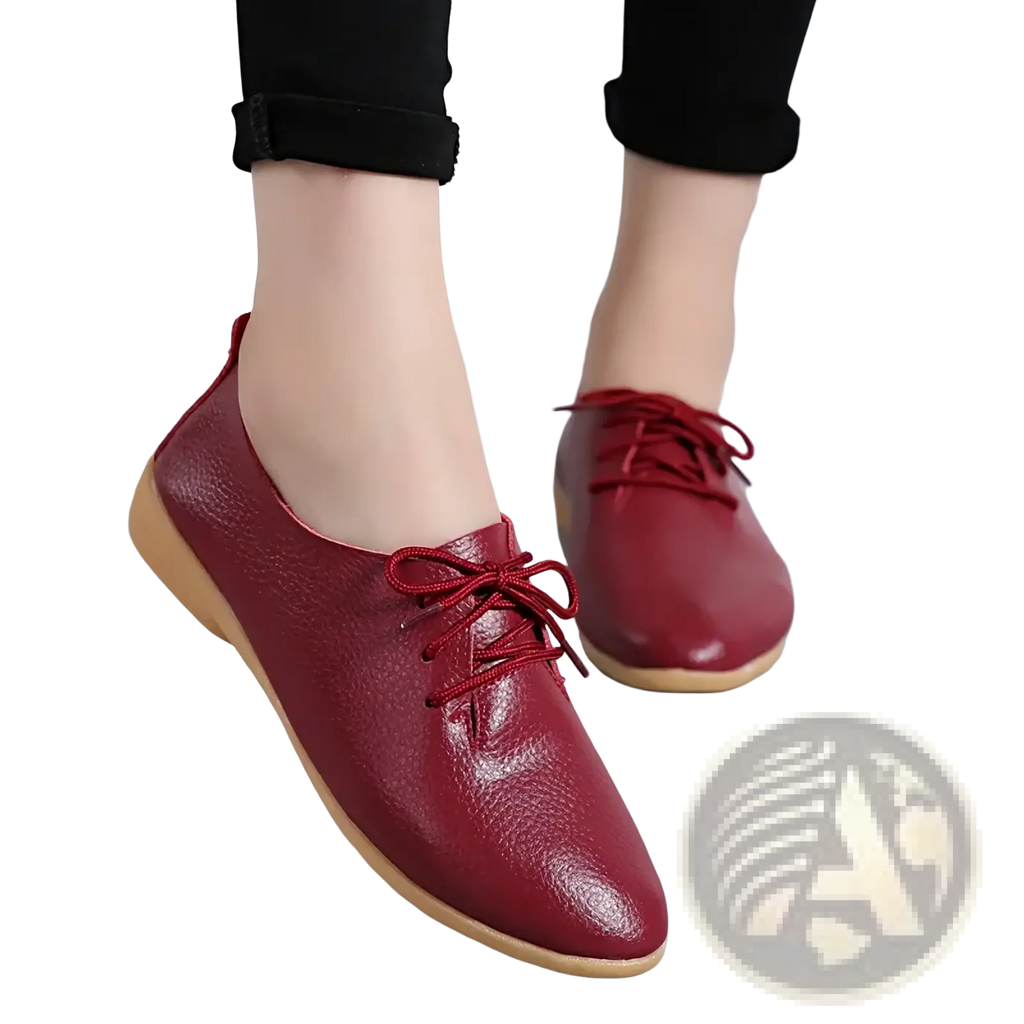 Genuine leather pointed toe women flats in burgundy with soft pebbled texture and light beige lace-up soles